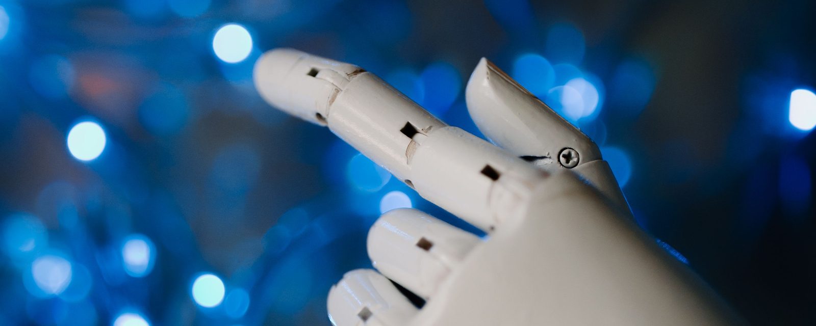 A robotic hand reaching out against blue lights, representing AI-powered search